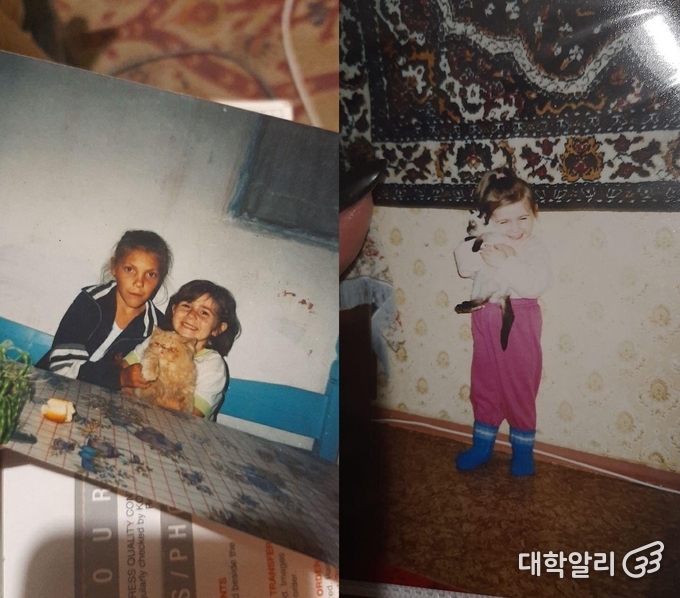 Childhood photo of Ness with her sister and pet cat. (Courtesy of Ness)